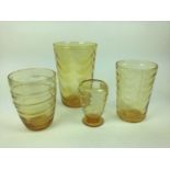 Three Whitefriars Amber wave ribbed vases, 25cm, 19.5cm and 14.5cm plus a ribbon trailed vase, 18cm