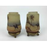 Pair of small glass nightlights decorated with Egyptian scenes on gilt metal stands