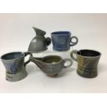 Five salt glazed studio pottery items including Mark Compton jug, 11cm high, two Jane Hamlyn mugs, b