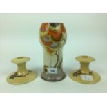 Clarice Cliff vase and a pair of Clarice Cliff candlesticks