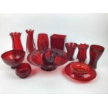 Twelve pieces of Whitefriars Ruby red glass including large bowl, 31cm diameter, controlled bubble