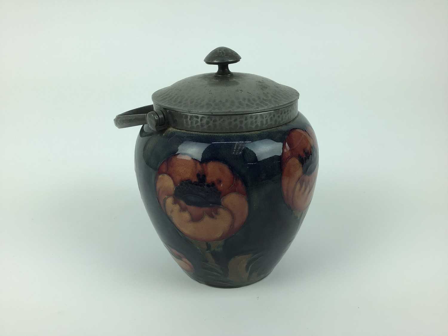 Moorcroft pewter mounted biscuit barrel decorated in the poppy pattern on blue and green ground