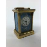 Halcyon Days miniature enamel carriage clock with floral decoration on blue ground, 7.5cm high