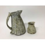 Two Aki Moriuchi textured jugs, 21cm and 10cm high