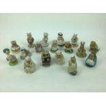 Three Beswick Beatrix Potter figures, five Royal Albert Beatrix Potter figures and nine Royal Doulto