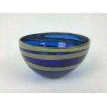 Good quality blue art glass bowl with yellow swirls, signed Emsie Sharp, 2005, 18cm diameter