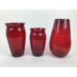 Three large Whitefriars Ruby red wave ribbed vases, 31cm, 27.5cm and 23.5cm