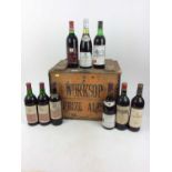 Group of nine wines to include: Chateau Talbot, Caron Segur 1959 and others, contained in a wooden c