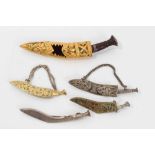 Five 1920s/30s Indian Kukri dagger brooches some with yellow metal mounts