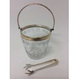 Good quality cut glass ice bucket with silver plated mounts and swing handle, together with a pair o