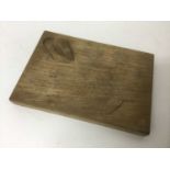 In the manner of Robert Mouseman Thompson carved oak cheese board