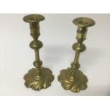 Pair of George I / II wrythen brass candlesticks