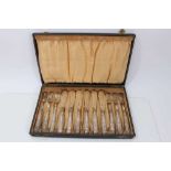 Set twelve 1920s silver handled fish knives and forks with plated blades and prongs in fitted box (