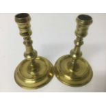 Near pair of early 18th century brass candlesticks