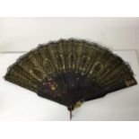 19th century tortoishell and black lace fan with yellow metal armorials and monograms to ends