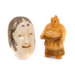 19th century carved ivory netsuke in the form of a sumo wrestler together with a noh mask