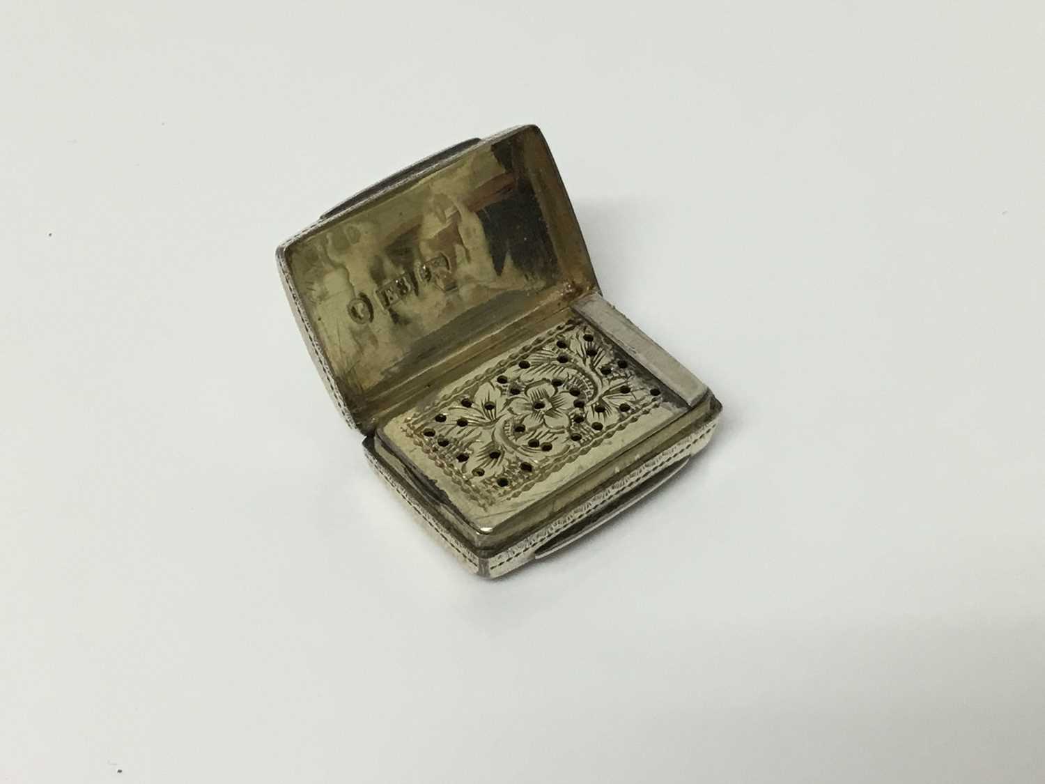 Victorian silver vinaigrette of typical form with pierced cover and gilded interior, by Edward Smith