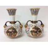 Pair of Royal Crown Derby Imari pattern bottle vases, twin-handled with mask terminals, 19.75cm heig