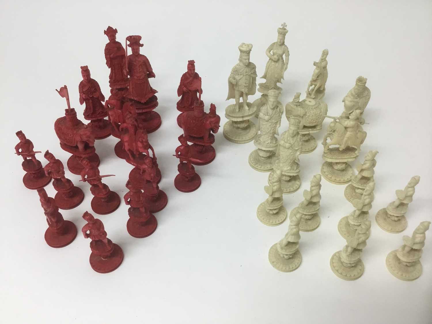 Fine 19th century carved and red stained ivory chess set