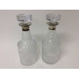 Pair of silver mounted and cut glass decanters