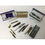Collection of pens and silver propelling pencils