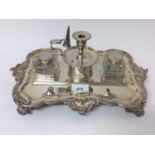 Late Victorian silver plated double inkstand with cut glass bottles and central taper stick with snu