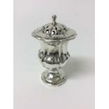 Good quality William IV silver pepperette, of shaped campagna form, pierced cover and shaped pedesta
