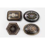 Group of four 19th century tortoishell piqué work brooches various, with floral decoration. 35mm-45m