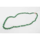 Old Chinese jade/green hardstone bead necklace with a string of graduated spherical beads measuring