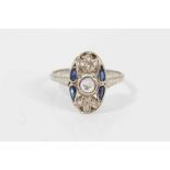 Art Deco diamond and sapphire plaque ring with an oval openwork plaque with a central rose cut diamo