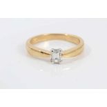 Diamond single stone ring with a rectangular step-cut diamond estimated to weigh approximately 0.25c
