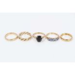 18ct gold wedding ring, two 9ct gold sapphire and diamond dress rings and two 9ct gold bands.