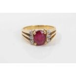 18ct gold diamond and red stone dress ring with an oval mixed cut red stone (possibly a synthetic ru