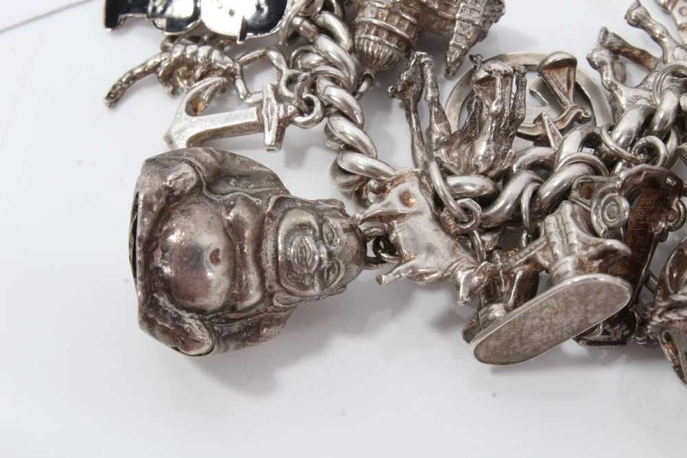Silver charm bracelet with a collection of silver and white metal charm and padlock clasp. - Image 4 of 8