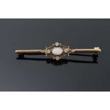 Edwardian-style opal and diamond bar brooch with an oval cabochon opal and four single cut diamonds