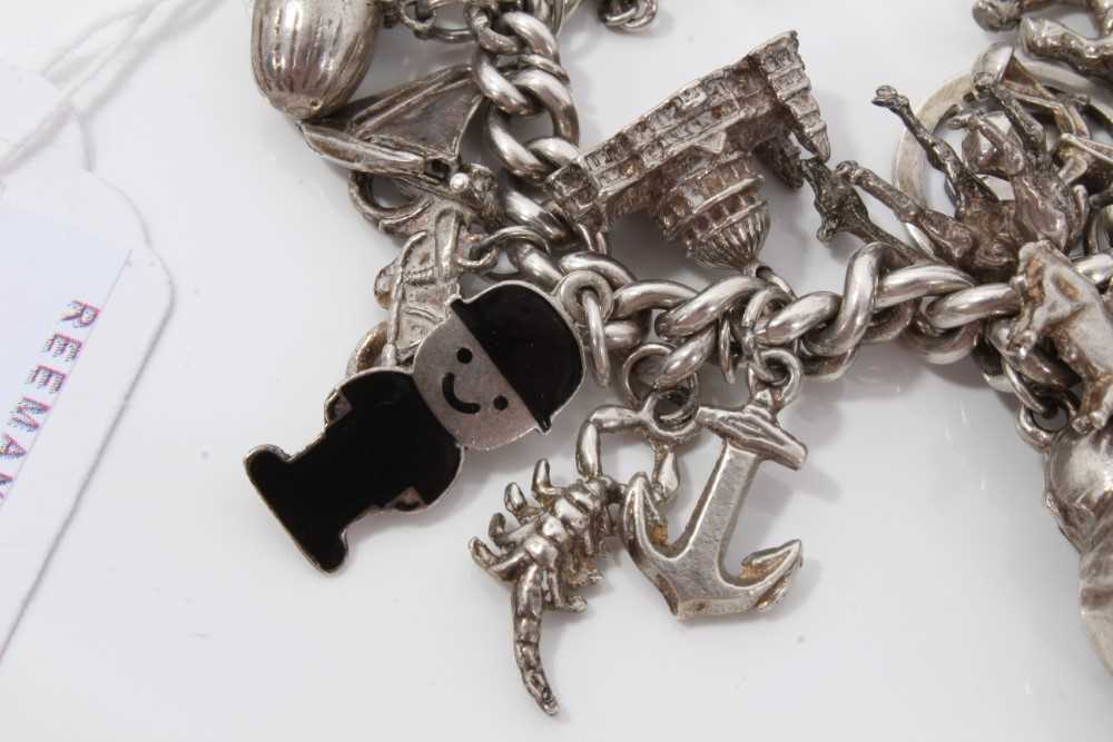 Silver charm bracelet with a collection of silver and white metal charm and padlock clasp. - Image 3 of 8