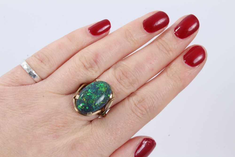 Black opal single stone ring with an oval black opal cabochon measuring approximately 20mm x 13mm x - Image 6 of 7