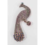 Late 19th century Indian diamond, ruby and sapphire and gem set brooch in the form of a peacock