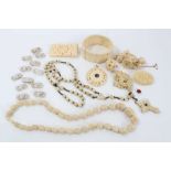Group of antique ivory, bone and similar jewellery to include a 1920s carved ivory pendant with cen