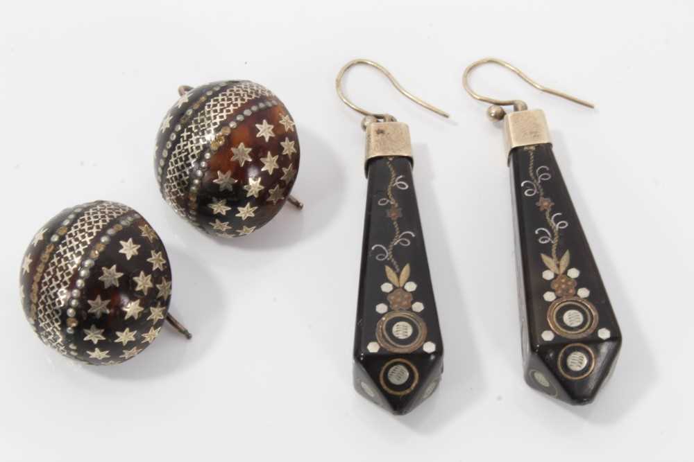 Two pairs of 19th century piqué work earrings, one pair of circular domed form with star decoration,