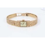 Lady's 9ct gold Roamer wristwatch on integral gold bracelet