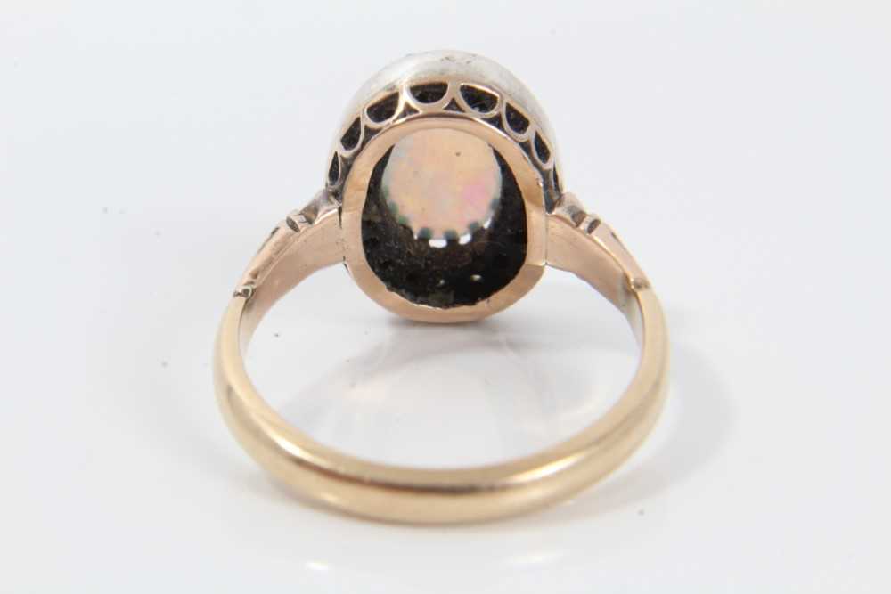 Antique opal and diamond cluster ring with an oval cabochon opal surrounded by nineteen old cut diam - Image 5 of 9