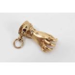 19th Yellow metal charm in the form of a hand, set with rubies
