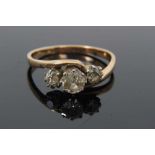 Diamond three stone ring with three old cut diamonds in cross-over claw setting on 9ct gold shank. E