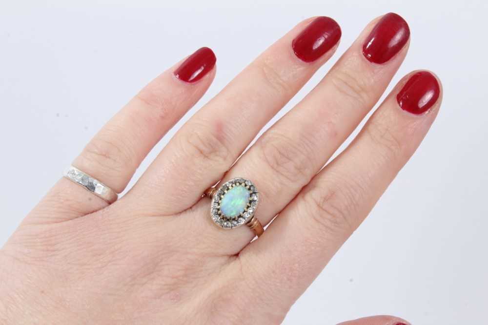 Antique opal and diamond cluster ring with an oval cabochon opal surrounded by nineteen old cut diam - Image 7 of 9