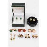 Nine pairs of gold earrings to include a pair of emerald single stone stud earrings in 18ct gold set