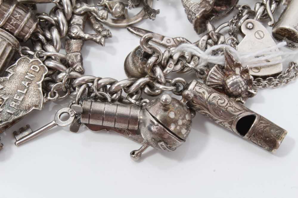 Silver charm bracelet with a collection of silver and white metal charm and padlock clasp. - Image 7 of 8