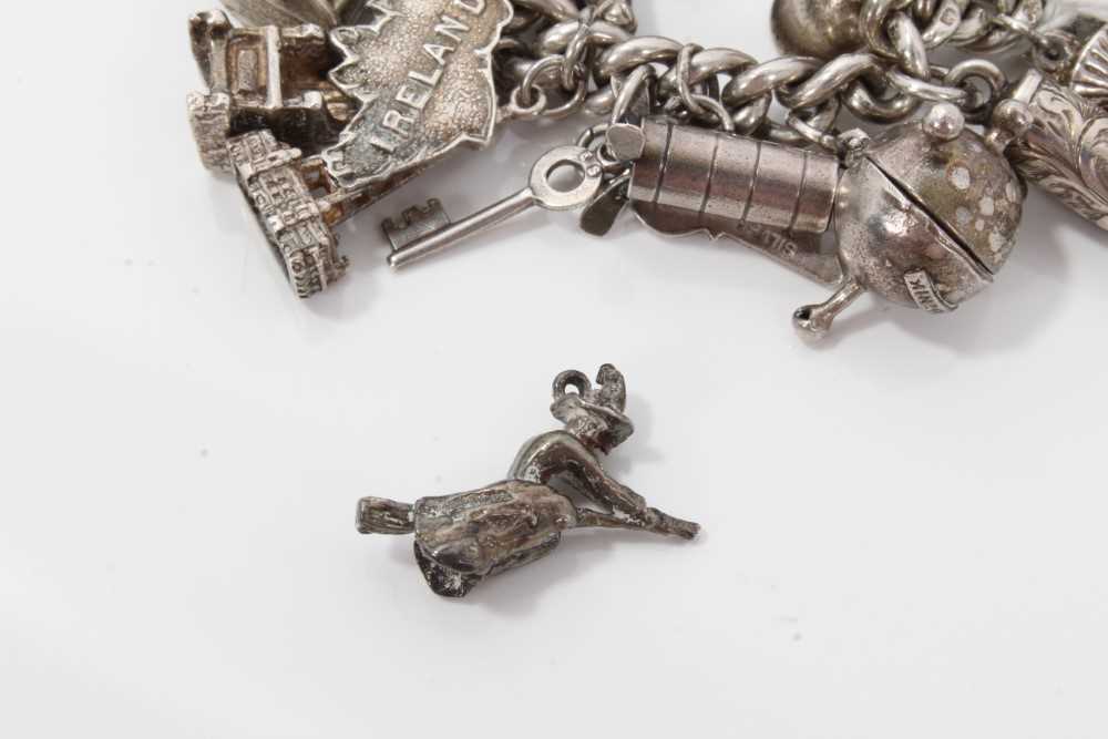 Silver charm bracelet with a collection of silver and white metal charm and padlock clasp. - Image 8 of 8