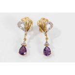 Pair of 18ct gold diamond and amethyst pendant earrings with a pear cut amethyst surmounted by three