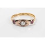 Victorian diamond and ruby three stone ring with a central old cut diamond in gypsy-style setting fl